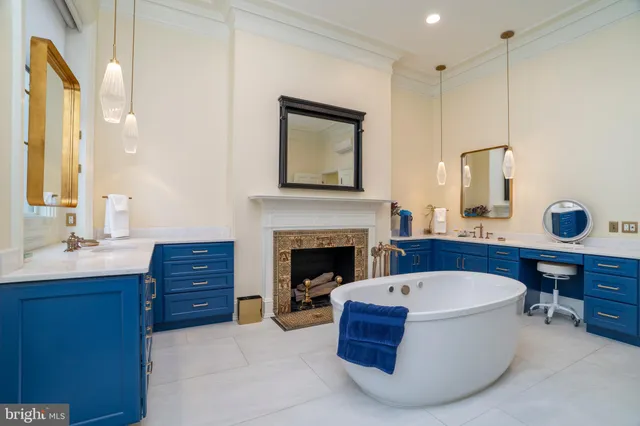 a bed room with furniture and a fireplace