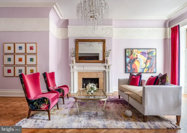 a living room with a fireplace a flat screen tv and a fireplace