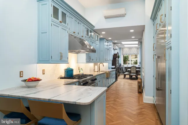 a living room with a couch and a fireplace