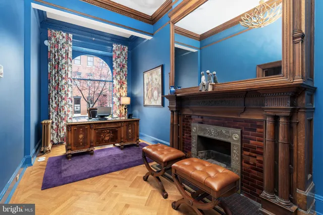 a bedroom with a bed fireplace and window