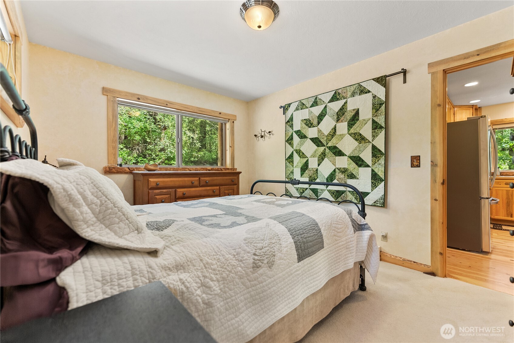 98 Homestead Road Winthrop, WA 98862 - Photo 18 of 40 a bedroom with a bed and window