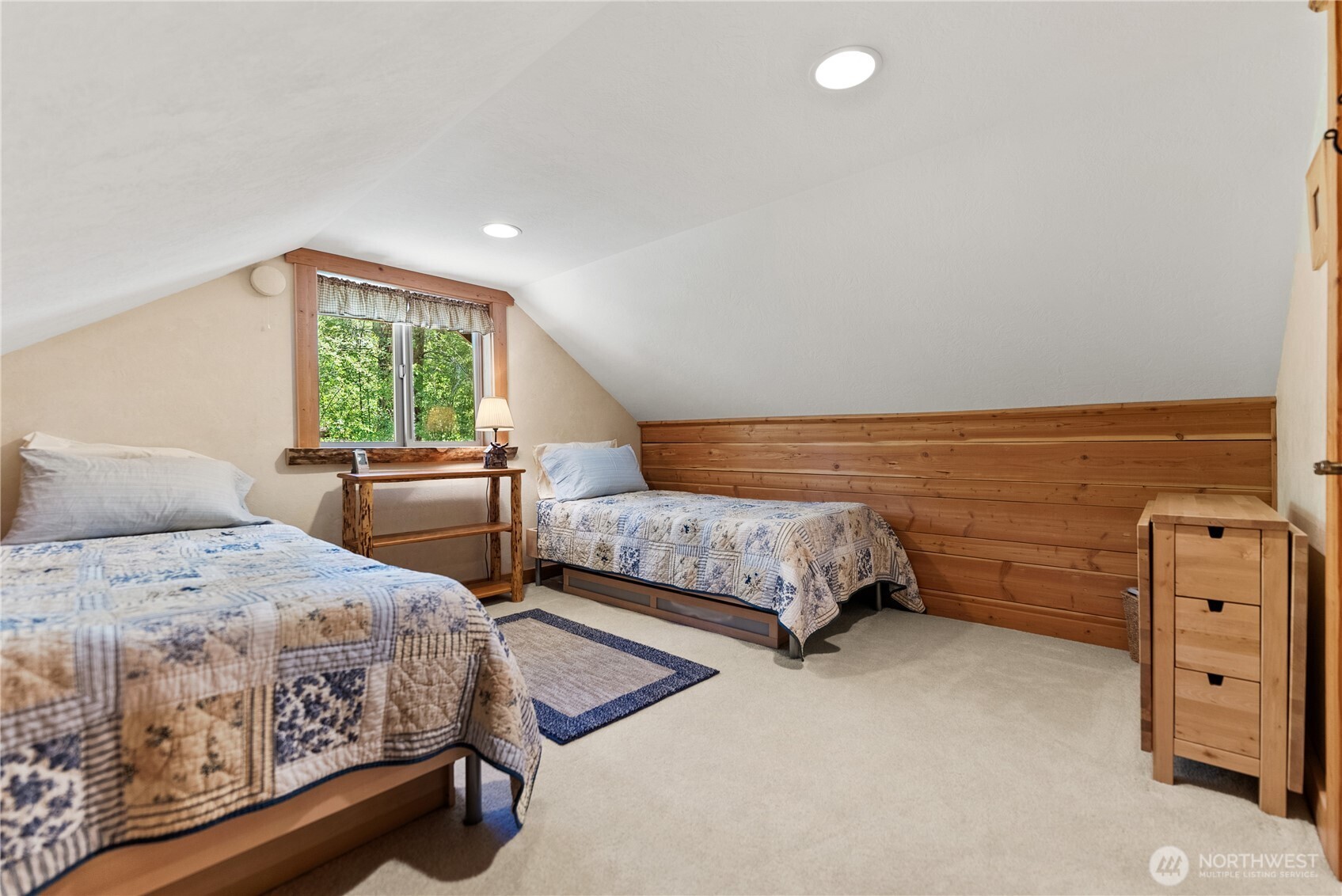 98 Homestead Road Winthrop, WA 98862 - Photo 23 of 40 a bedroom with a bed and a window