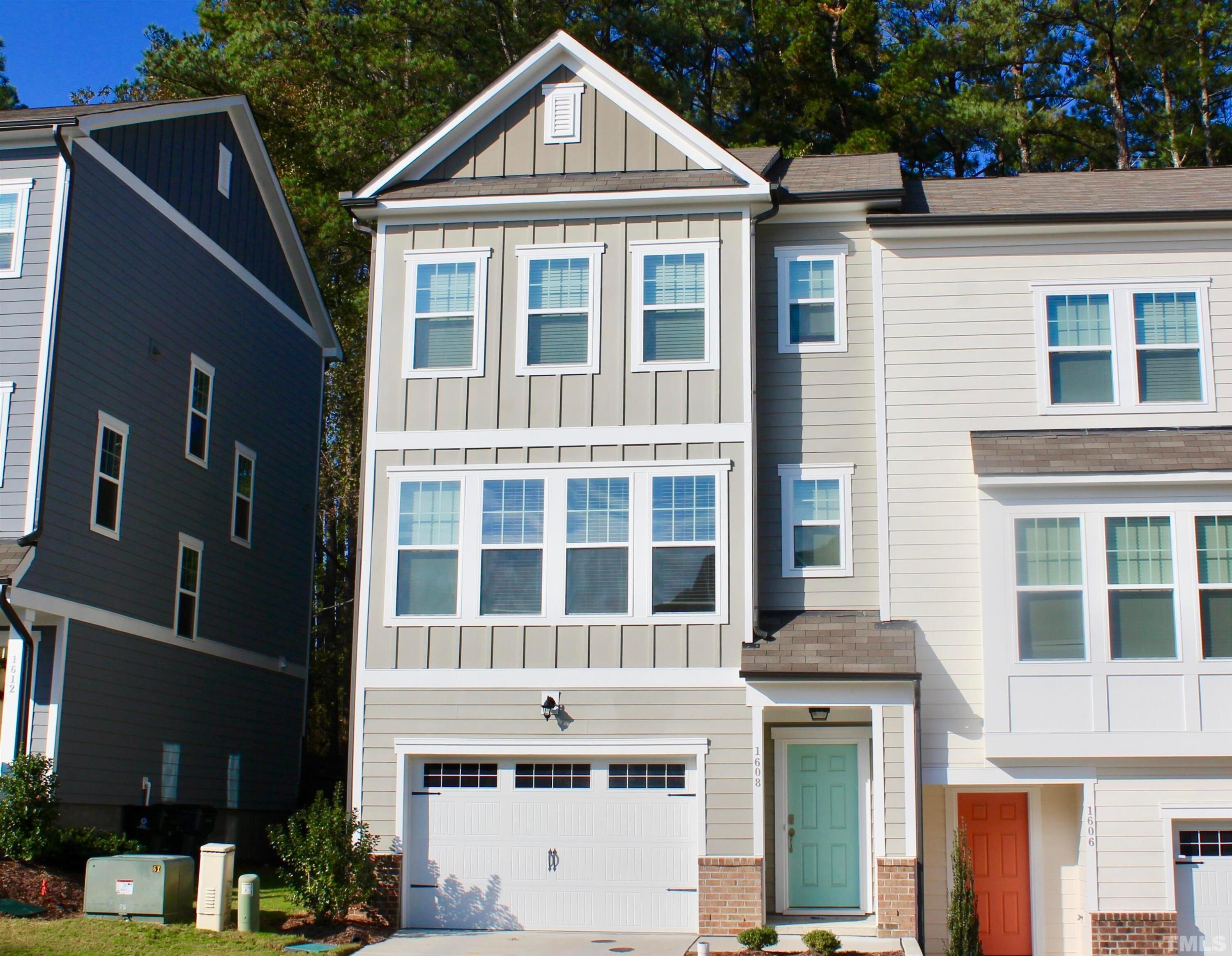 1608 Topaz Lane Apex, NC 27502 - Photo 1 of 23 a front view of a house with a yard
