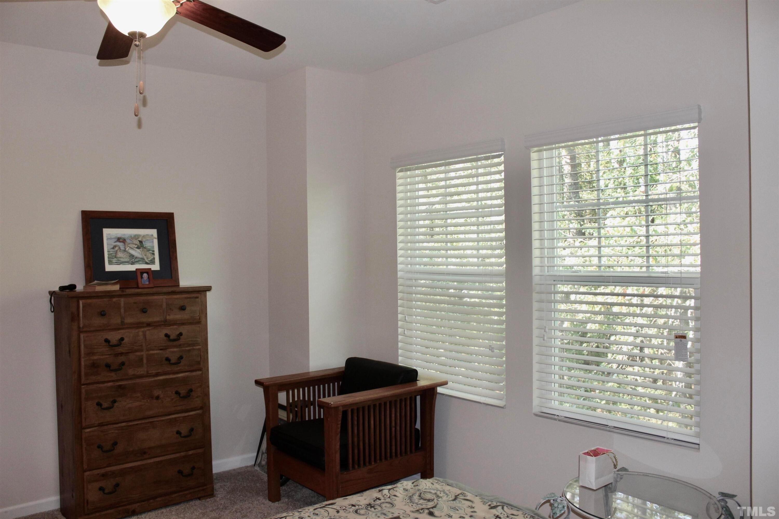 1608 Topaz Lane Apex, NC 27502 - Photo 12 of 23 a view of a workspace with furniture and a window