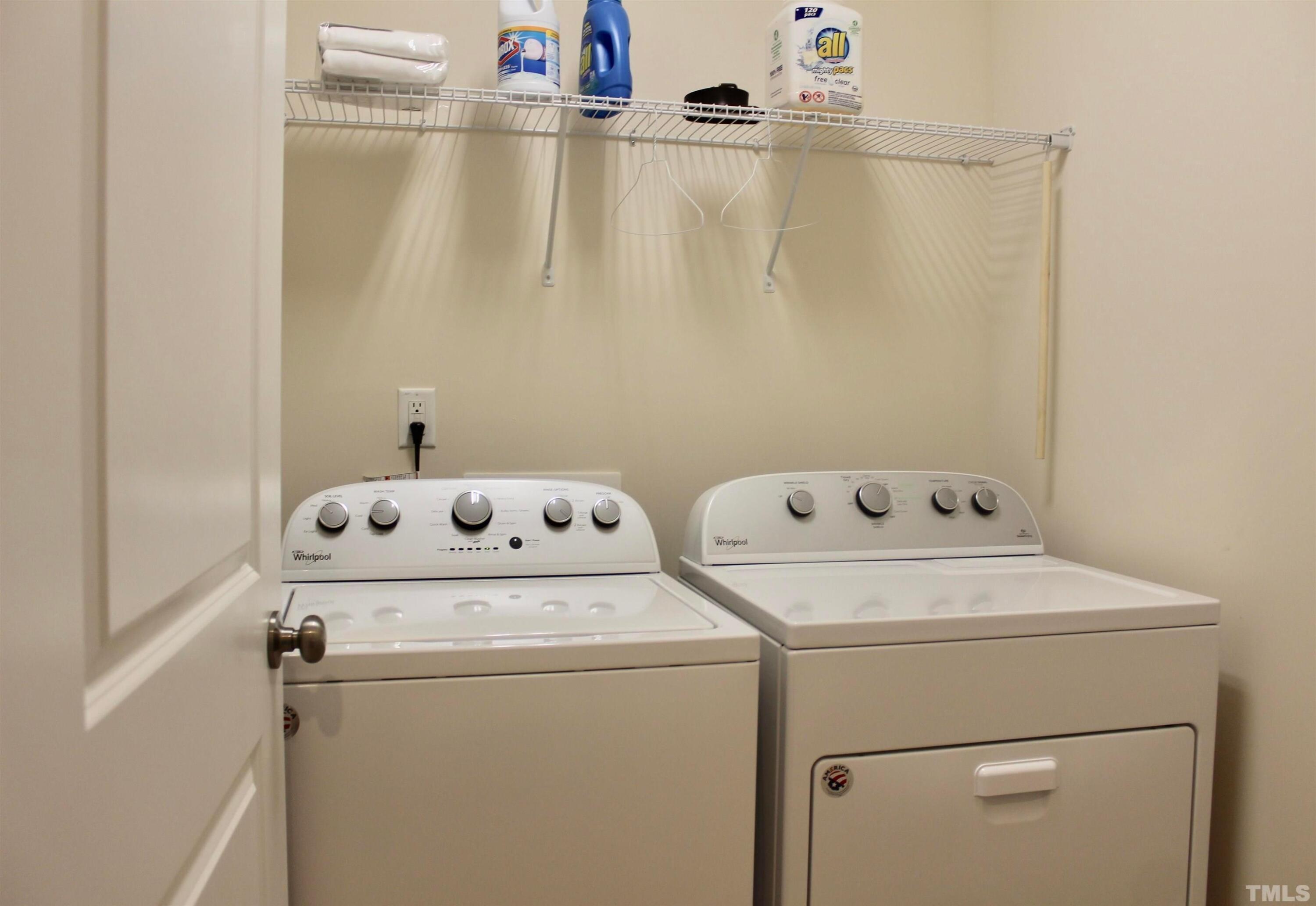 1608 Topaz Lane Apex, NC 27502 - Photo 15 of 23 a utility room with dryer and washer