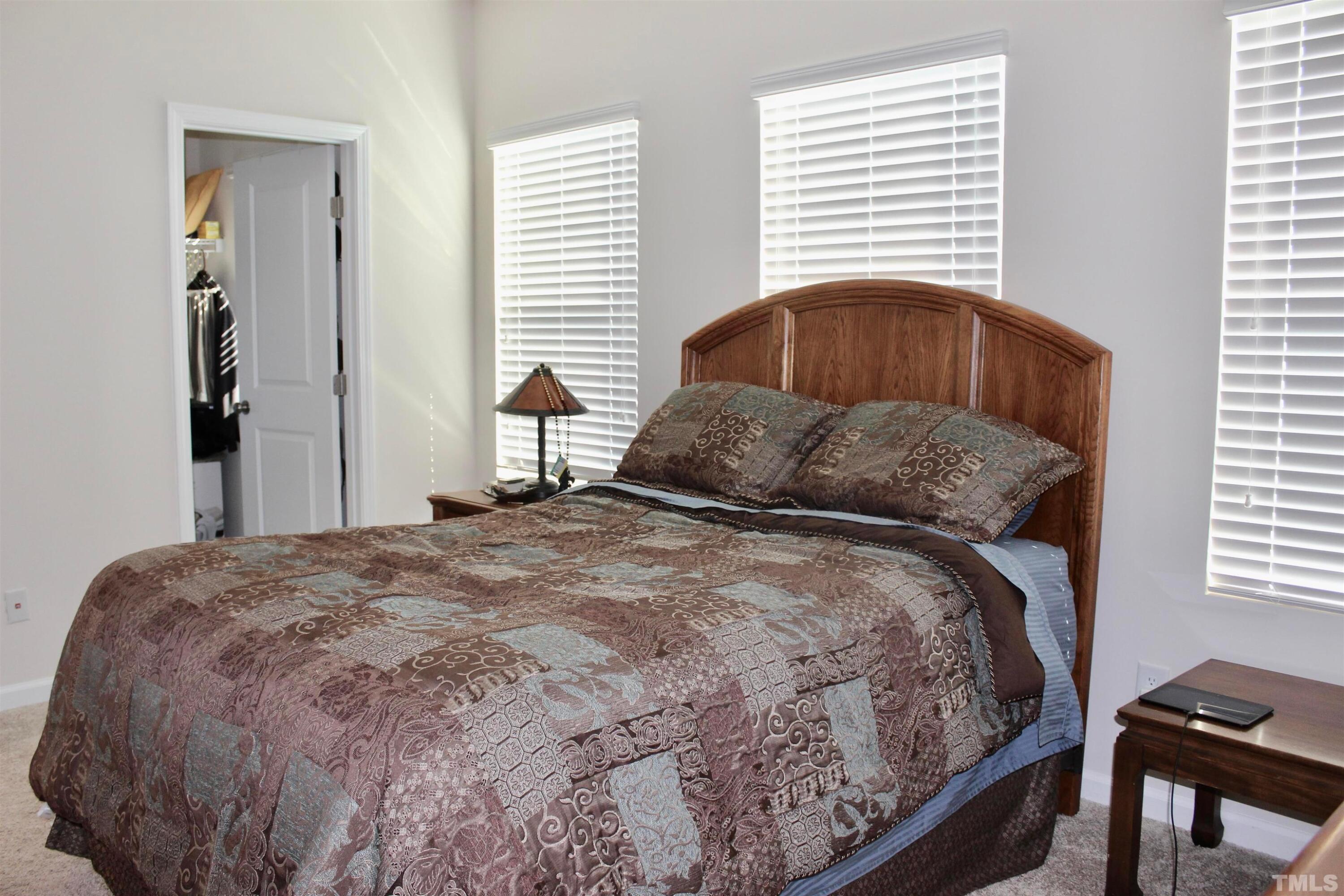 1608 Topaz Lane Apex, NC 27502 - Photo 16 of 23 a bedroom with a bed and a window