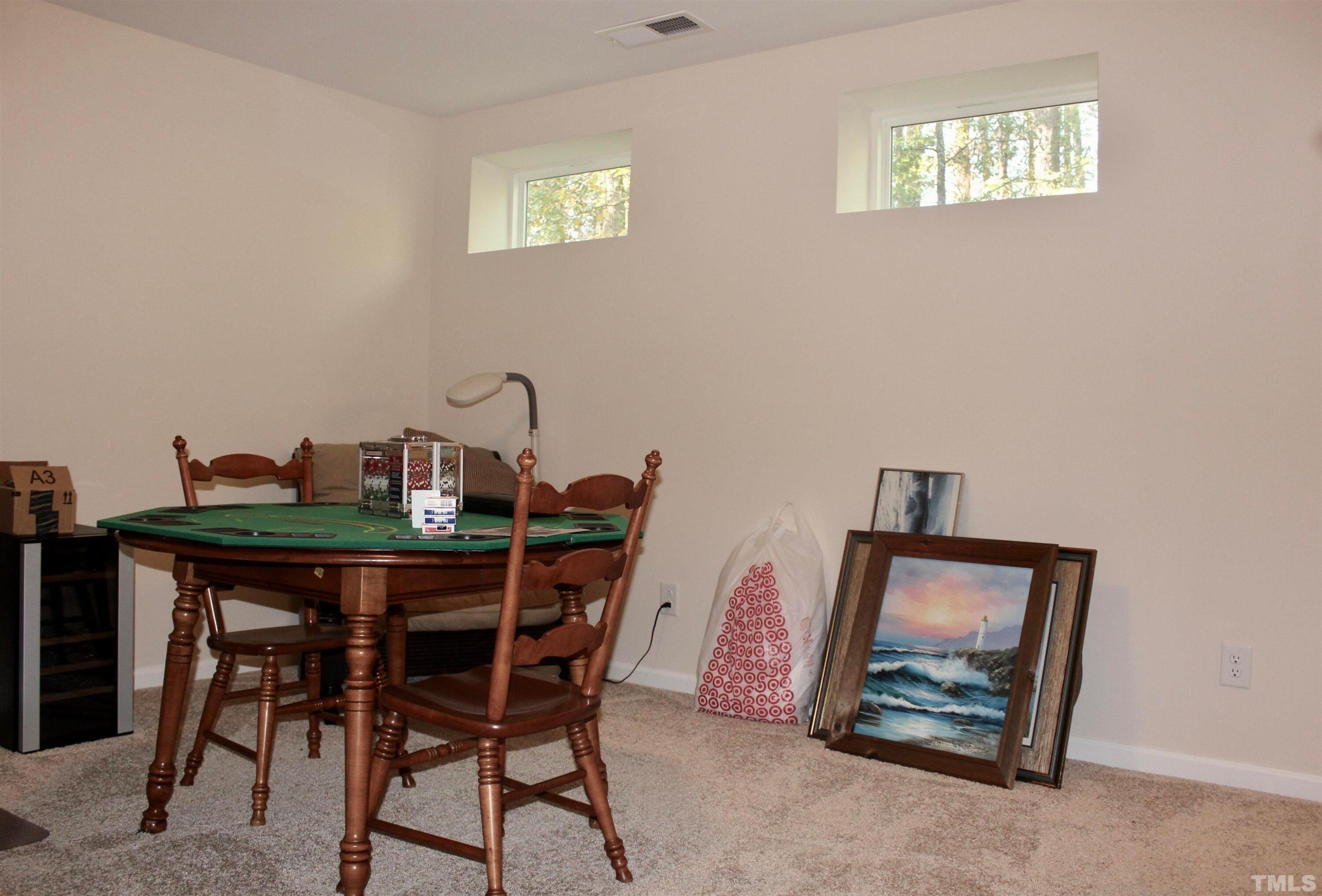 1608 Topaz Lane Apex, NC 27502 - Photo 18 of 23 a dining room with furniture and window