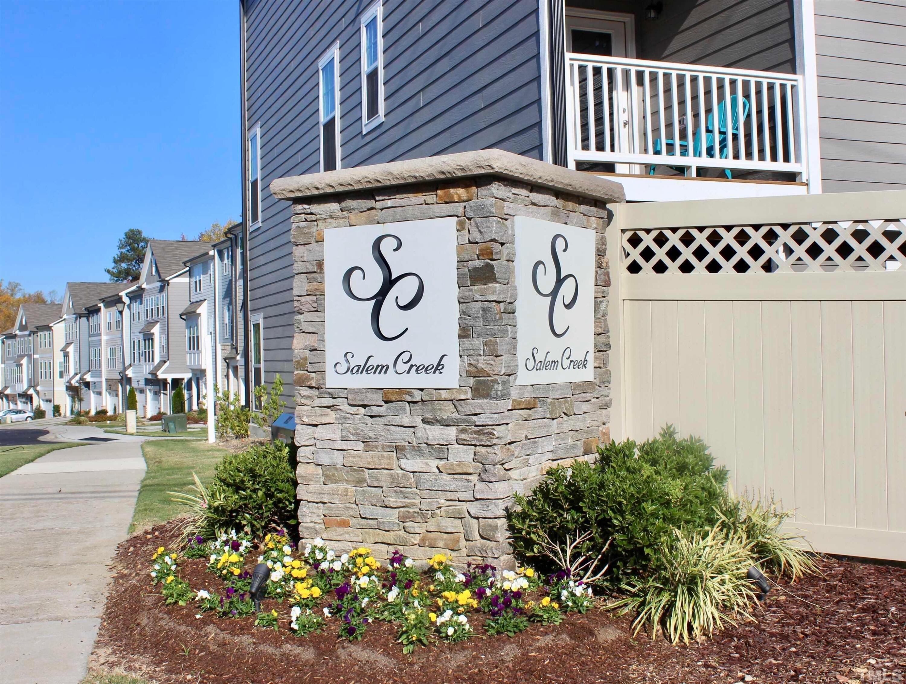 1608 Topaz Lane Apex, NC 27502 - Photo 22 of 23 a sign on the side of a building