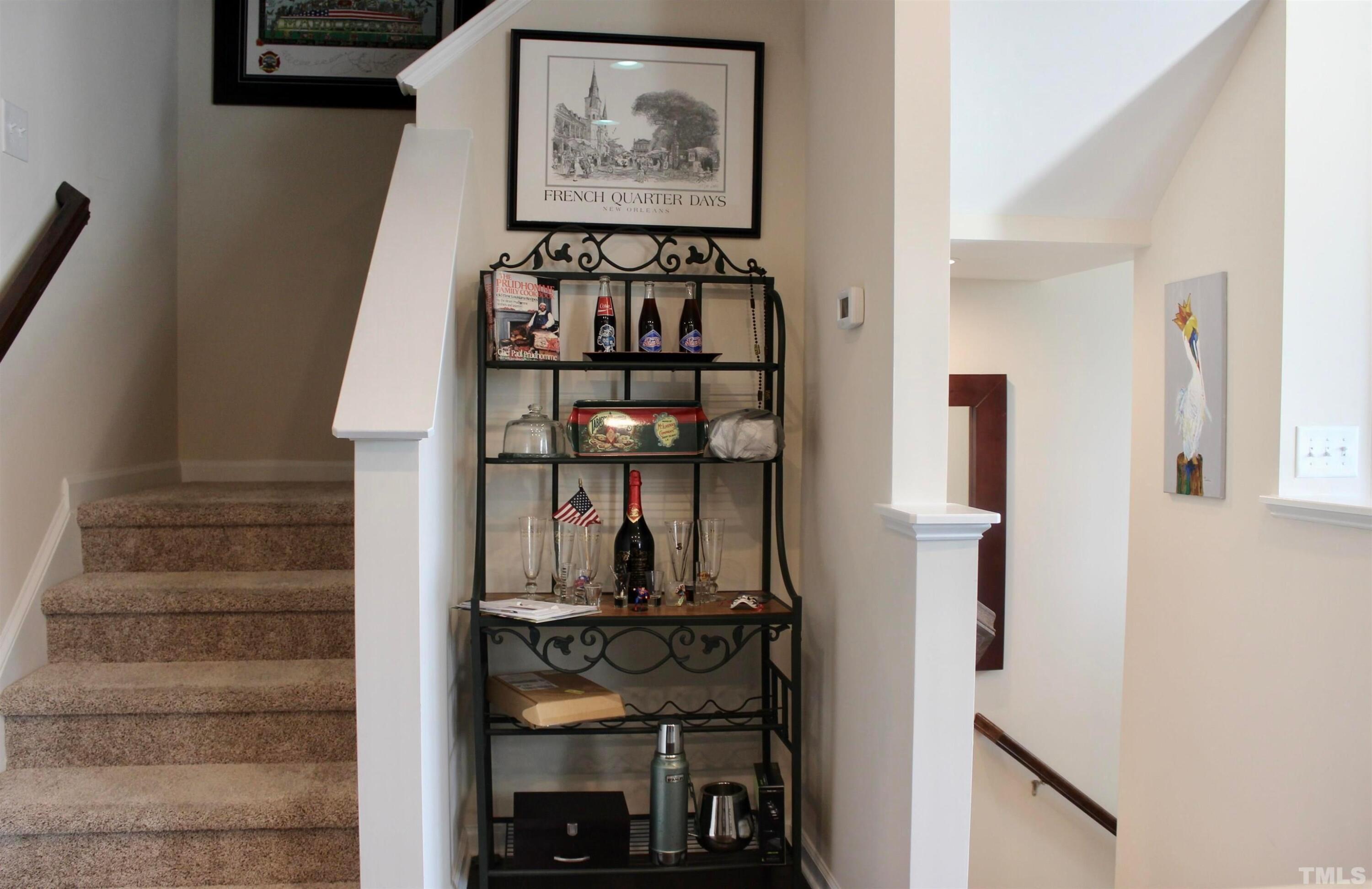 1608 Topaz Lane Apex, NC 27502 - Photo 9 of 23 a view of staircase with white walls and a window