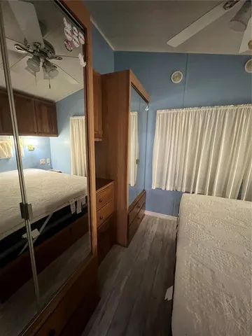 a bedroom with furniture and a window