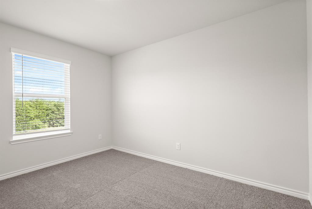 1510 Romans Road Ennis, TX 75119 - Photo 19 of 22 an empty room with a window