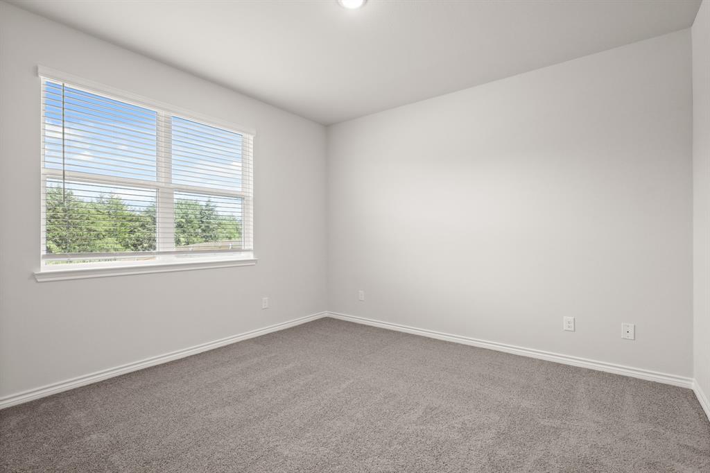 1510 Romans Road Ennis, TX 75119 - Photo 9 of 22 an empty room with a window