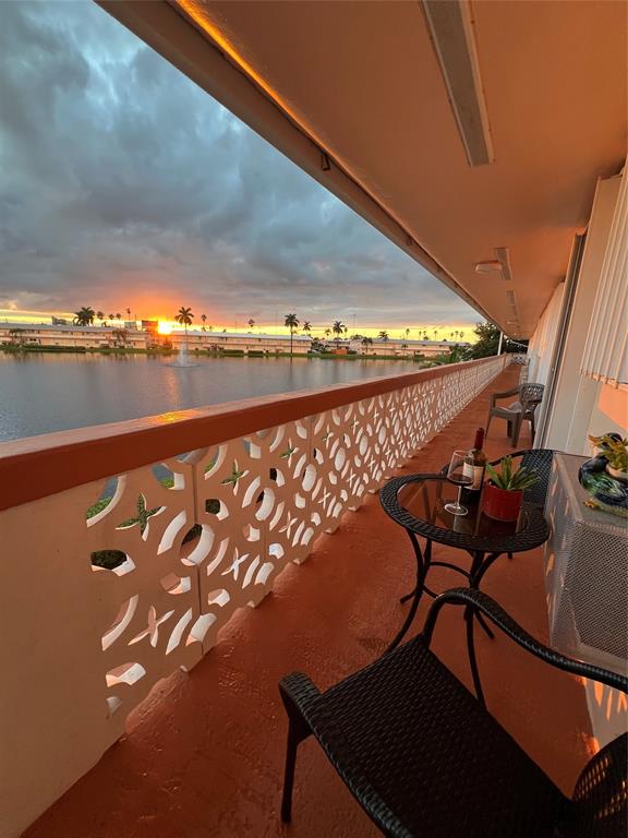 900 Southwest 10th Terrace, Unit S20 Hallandale Beach, FL 33009 - Photo 1 of 20 a view of swimming pool with outdoor seating and stairs
