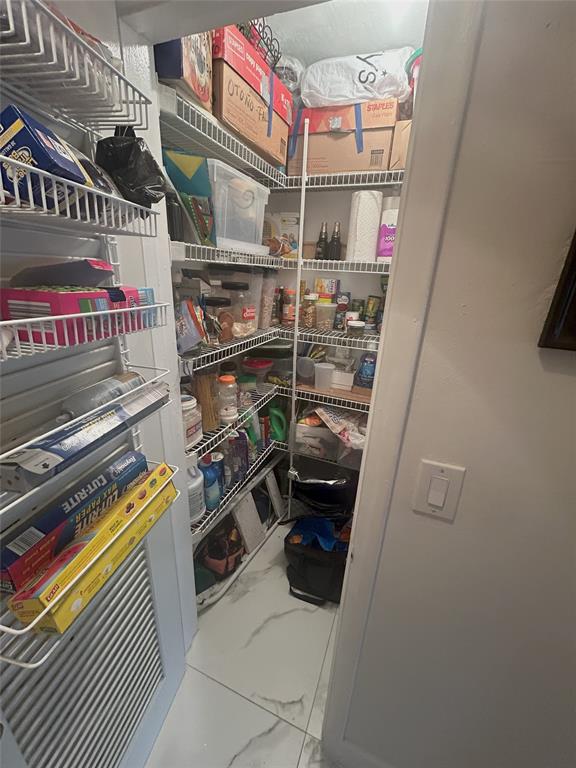 900 Southwest 10th Terrace, Unit S20 Hallandale Beach, FL 33009 - Photo 12 of 20 a storage room with washer and dryer