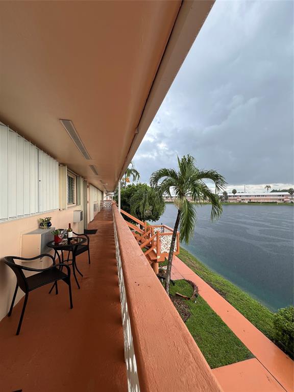 900 Southwest 10th Terrace, Unit S20 Hallandale Beach, FL 33009 - Photo 18 of 20 a view of a backyard with seating area