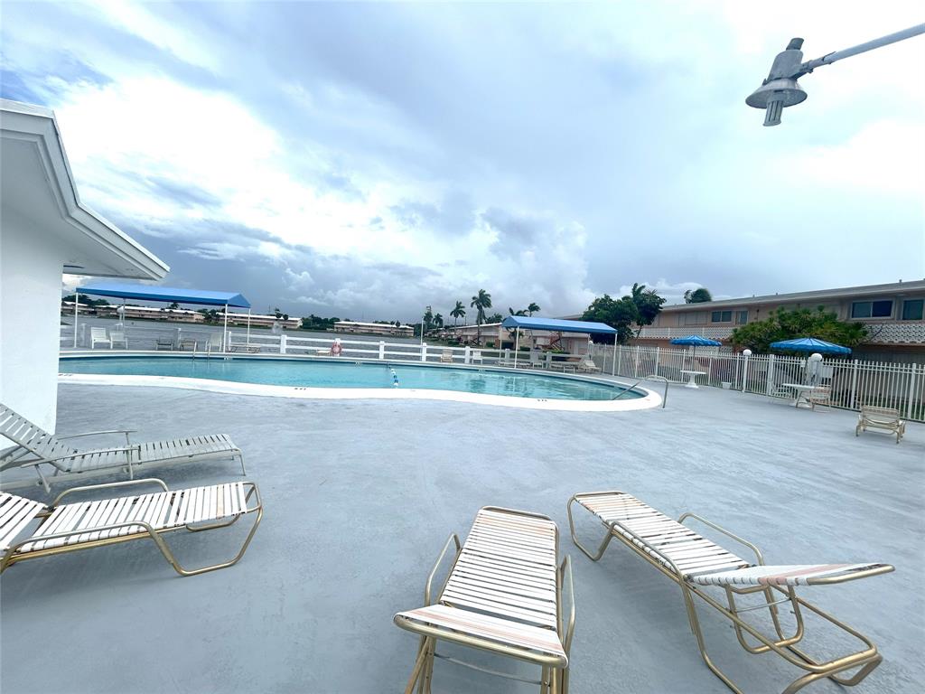 900 Southwest 10th Terrace, Unit S20 Hallandale Beach, FL 33009 - Photo 20 of 20 an outdoor view with patio