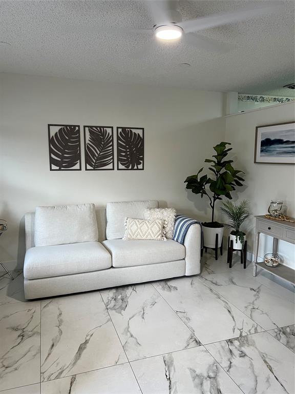 900 Southwest 10th Terrace, Unit S20 Hallandale Beach, FL 33009 - Photo 3 of 20 a living room with furniture and a couch