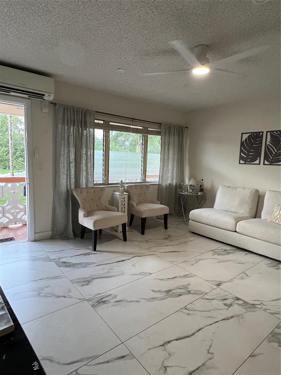 900 Southwest 10th Terrace, Unit S20 Hallandale Beach, FL 33009 - Photo 5 of 20 a living room with furniture and a window