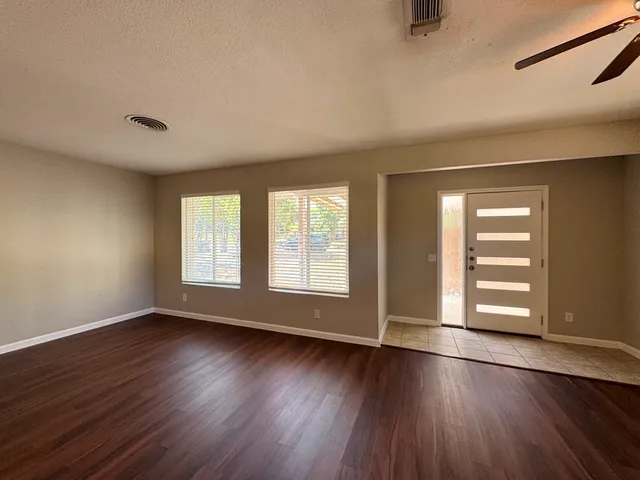 a kitchen with stainless steel appliances granite countertop wooden cabinets and a stove
