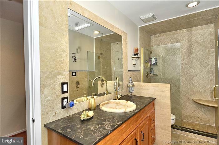 11727 Indian Ridge Road Reston, VA 20191 - Photo 19 of 30 Custom Hall Bath w/Black Marble Counter
