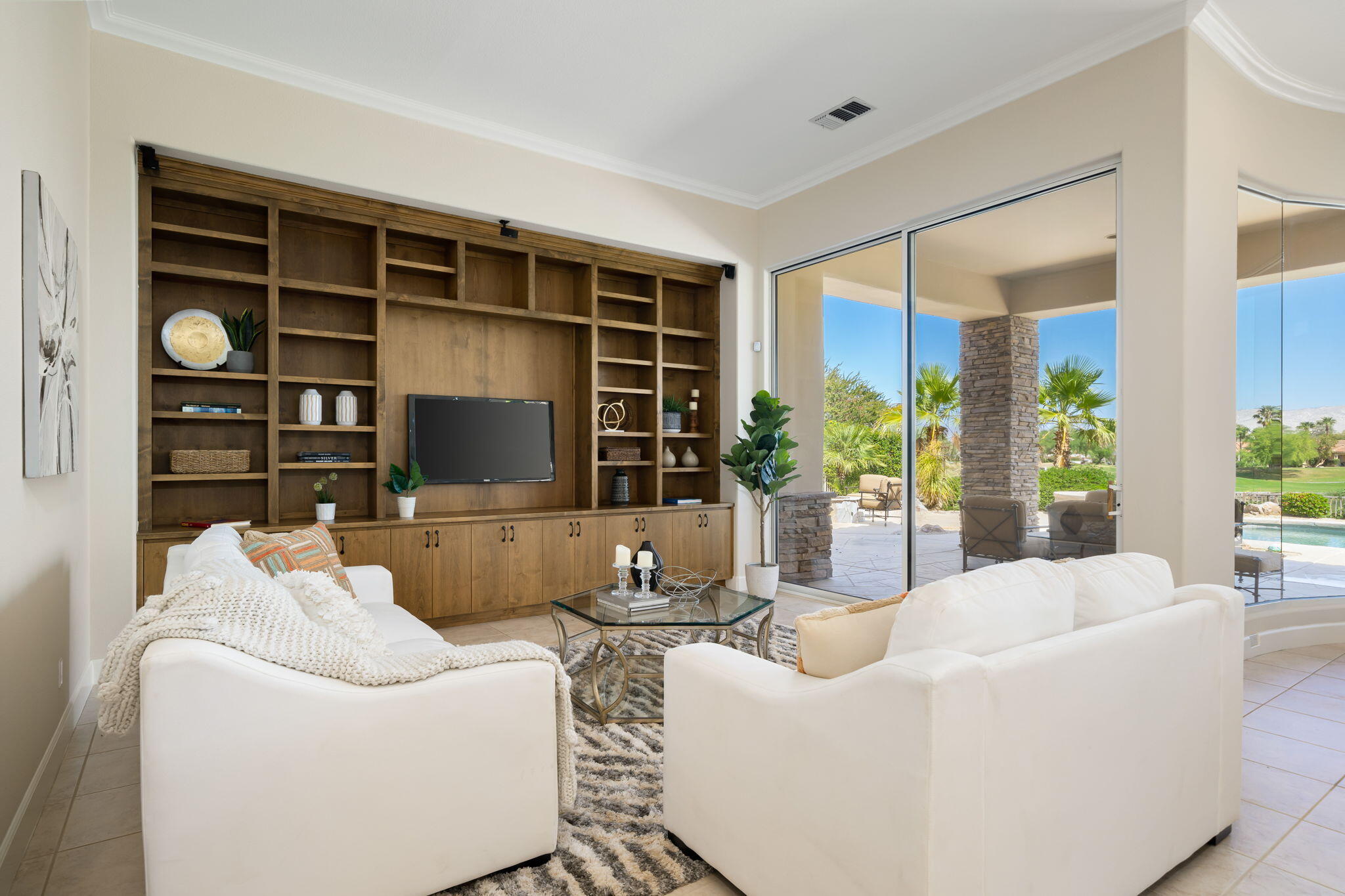 142 Loch Lomond Road Rancho Mirage, CA 92270 - Photo 13 of 62 a living room with furniture a flat screen tv and a large window