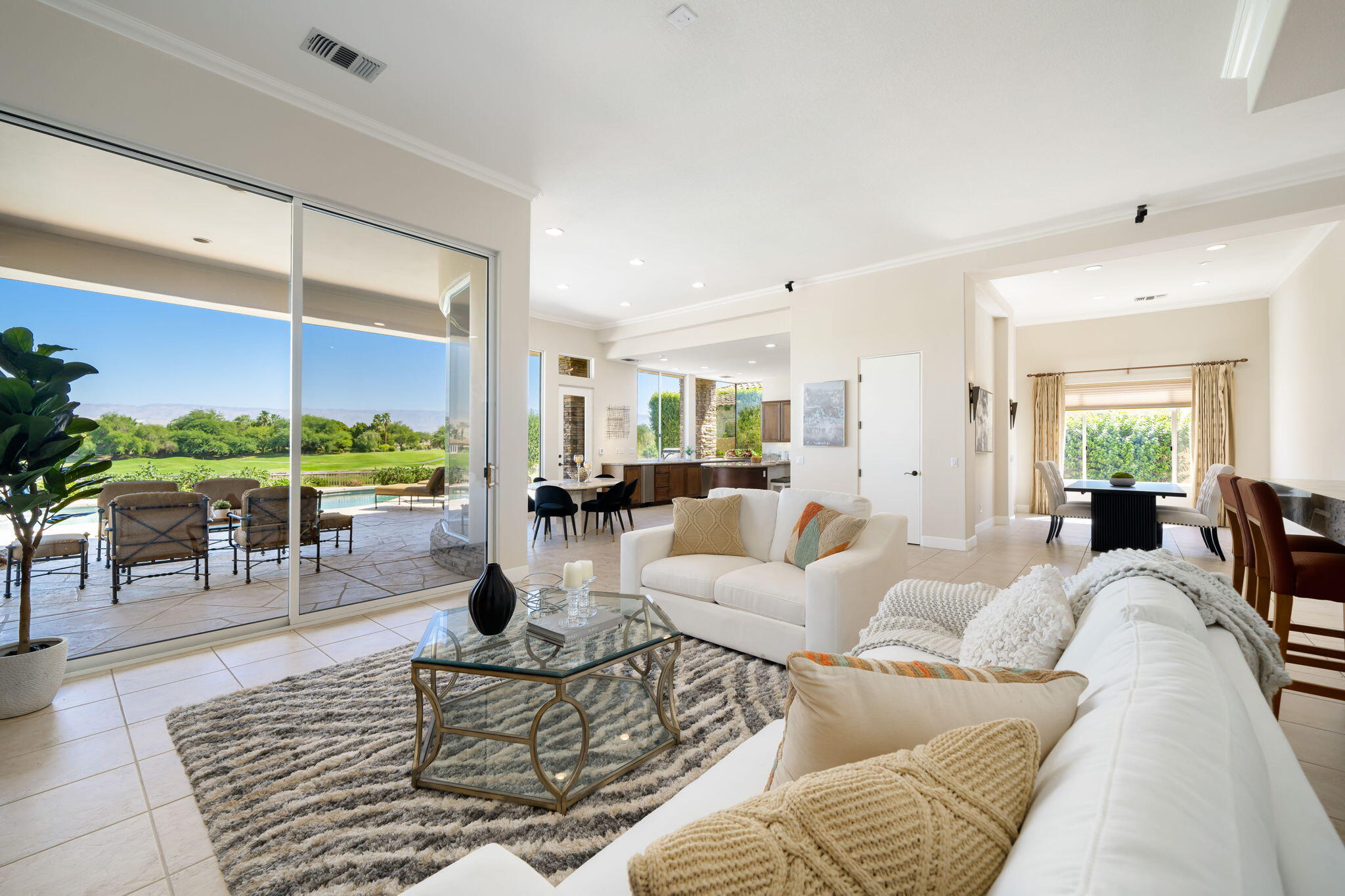 142 Loch Lomond Road Rancho Mirage, CA 92270 - Photo 14 of 62 a living room with furniture a rug and white walls