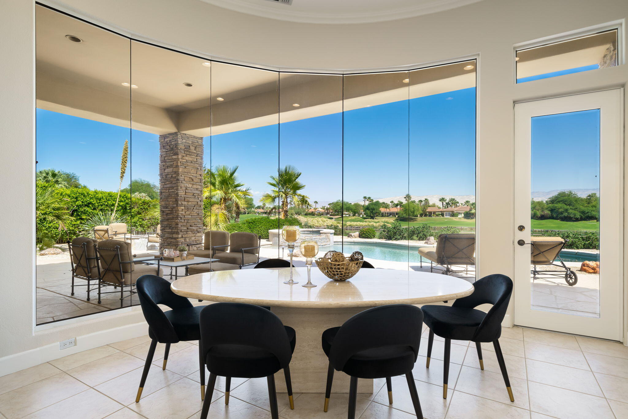 142 Loch Lomond Road Rancho Mirage, CA 92270 - Photo 20 of 62 a view of a dining room with furniture window and outside view