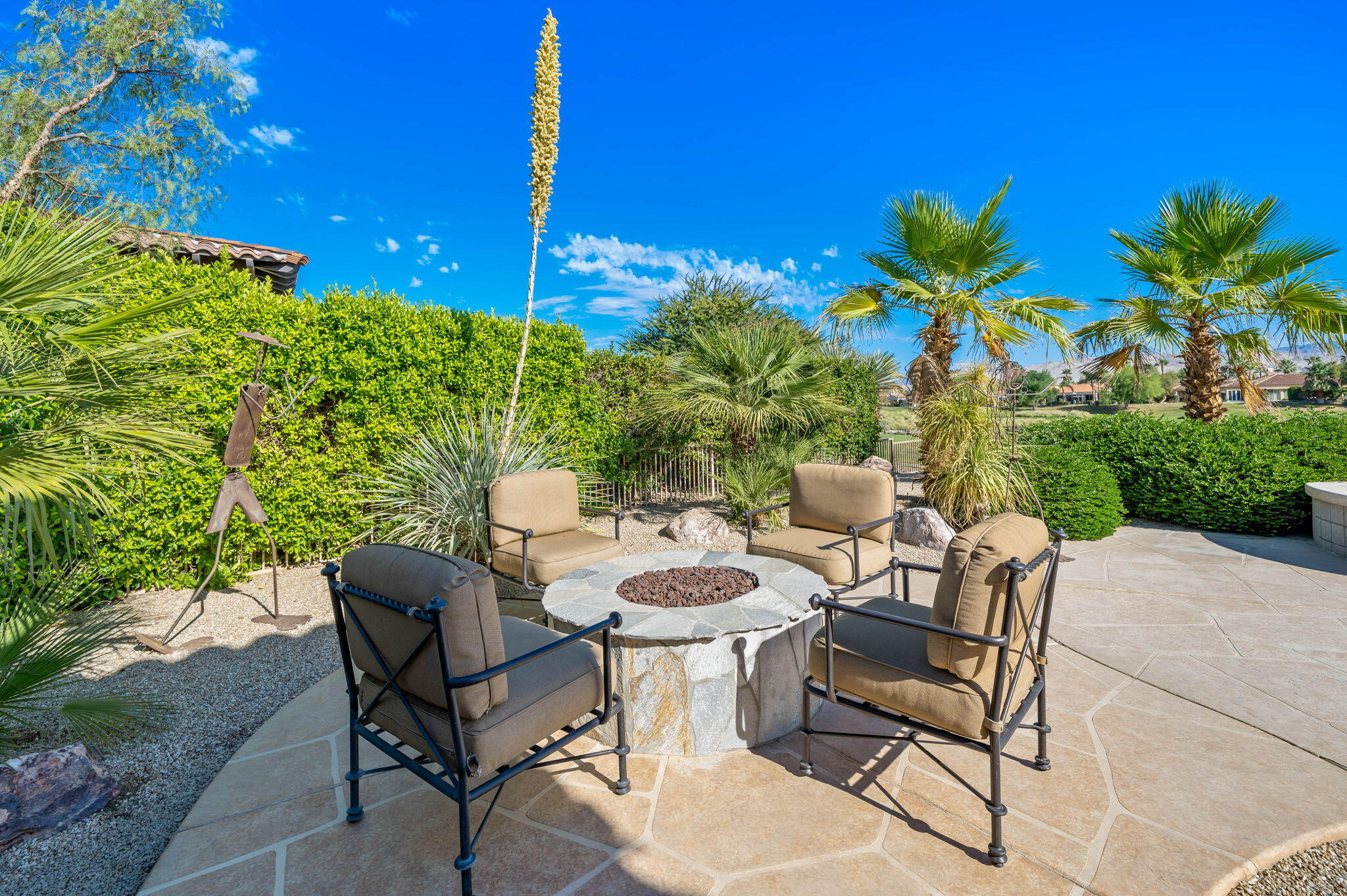 142 Loch Lomond Road Rancho Mirage, CA 92270 - Photo 28 of 62 a view of a patio with table and chairs and potted plants