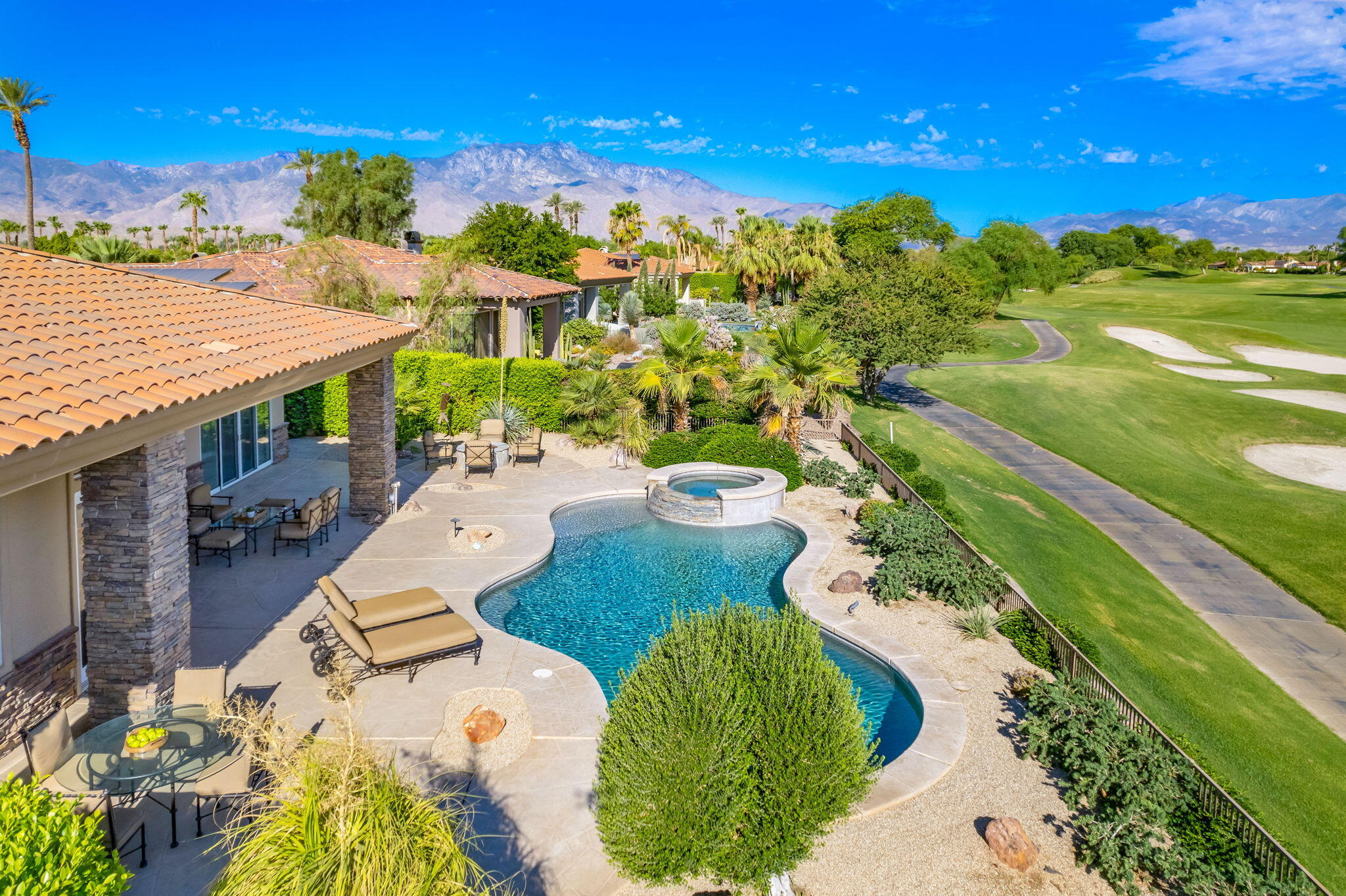 142 Loch Lomond Road Rancho Mirage, CA 92270 - Photo 3 of 62 a view of a swimming pool with a patio