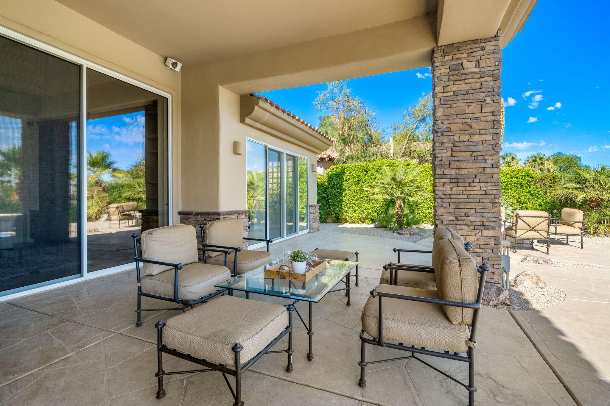 142 Loch Lomond Road Rancho Mirage, CA 92270 - Photo 36 of 62 a outdoor space with patio the couches and a potted plant with outer view