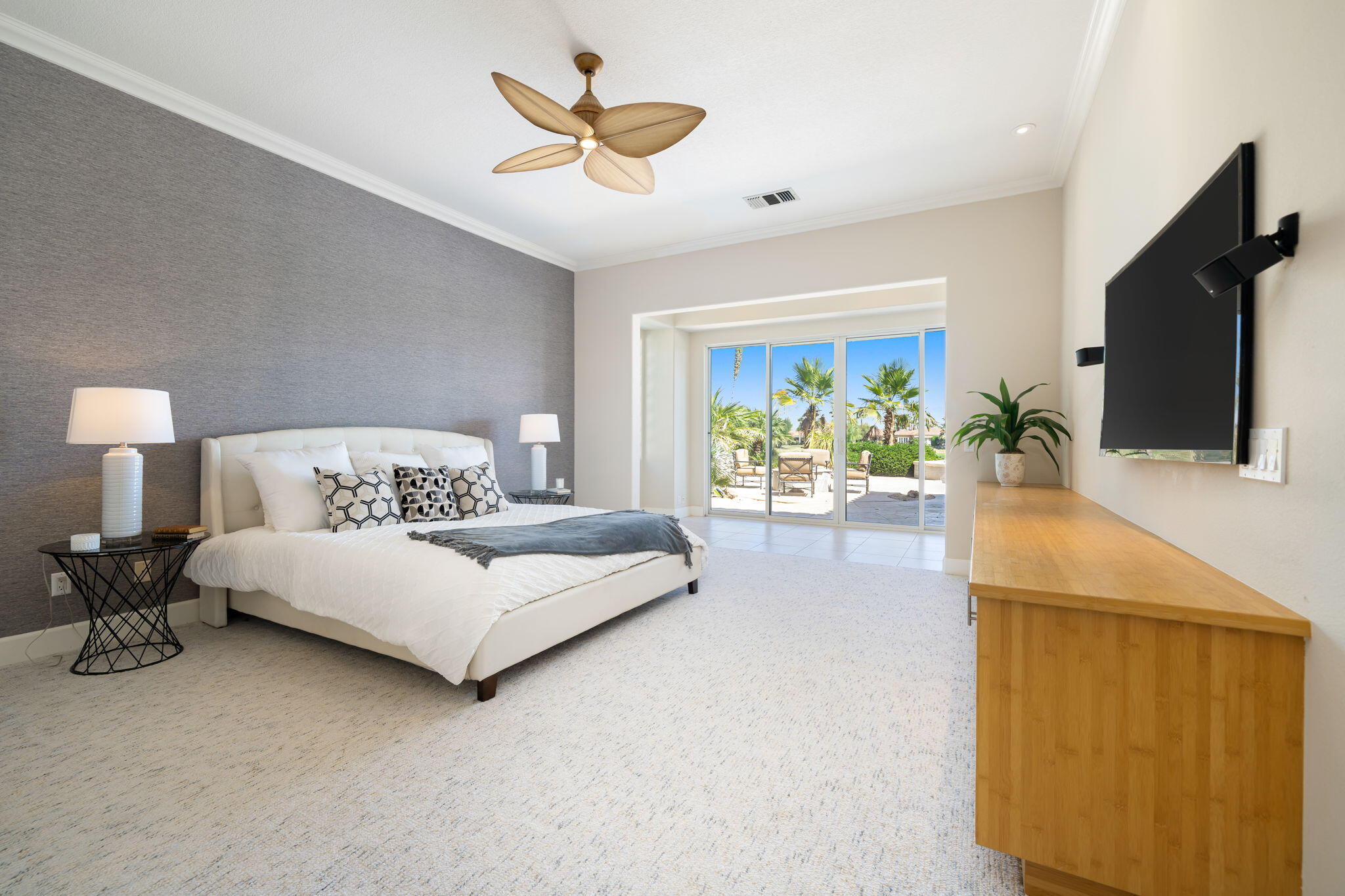 142 Loch Lomond Road Rancho Mirage, CA 92270 - Photo 39 of 62 a bedroom with bed and large windows