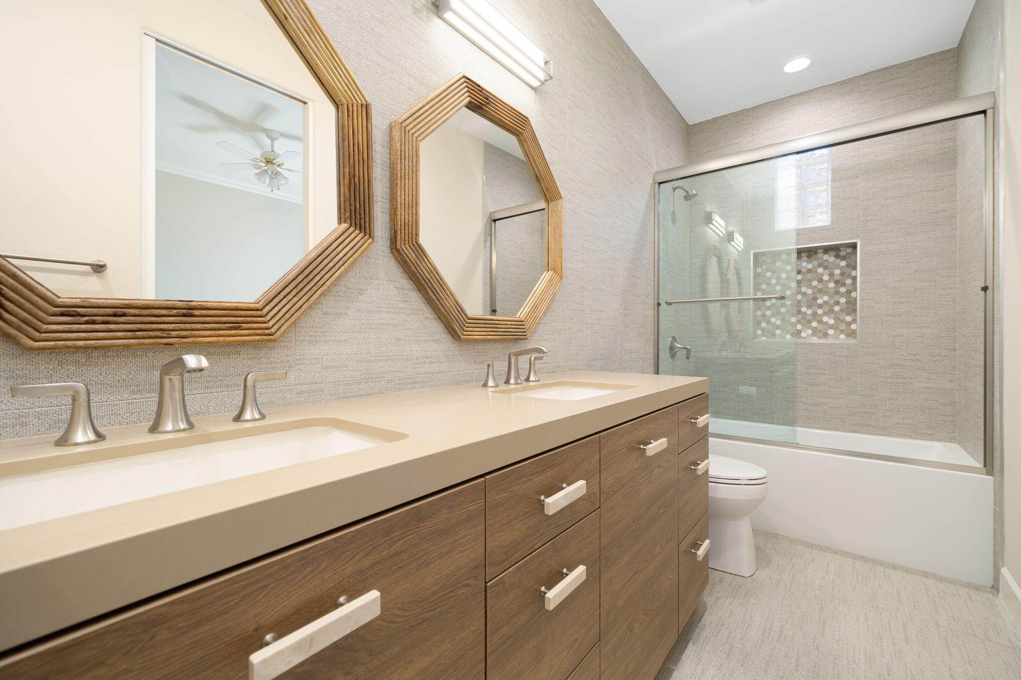 142 Loch Lomond Road Rancho Mirage, CA 92270 - Photo 52 of 62 a bathroom with a double vanity sink toilet and a mirror