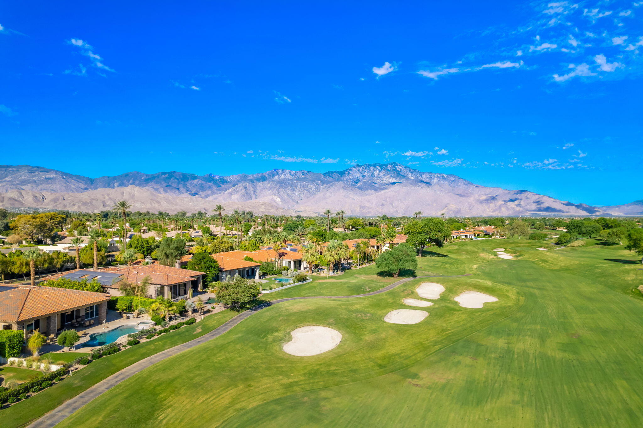 142 Loch Lomond Road Rancho Mirage, CA 92270 - Photo 59 of 62 a view of a city with mountains in the background