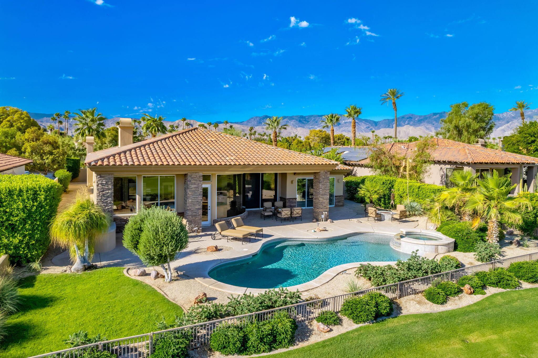142 Loch Lomond Road Rancho Mirage, CA 92270 - Photo 62 of 62 a view of a house with swimming pool and sitting area