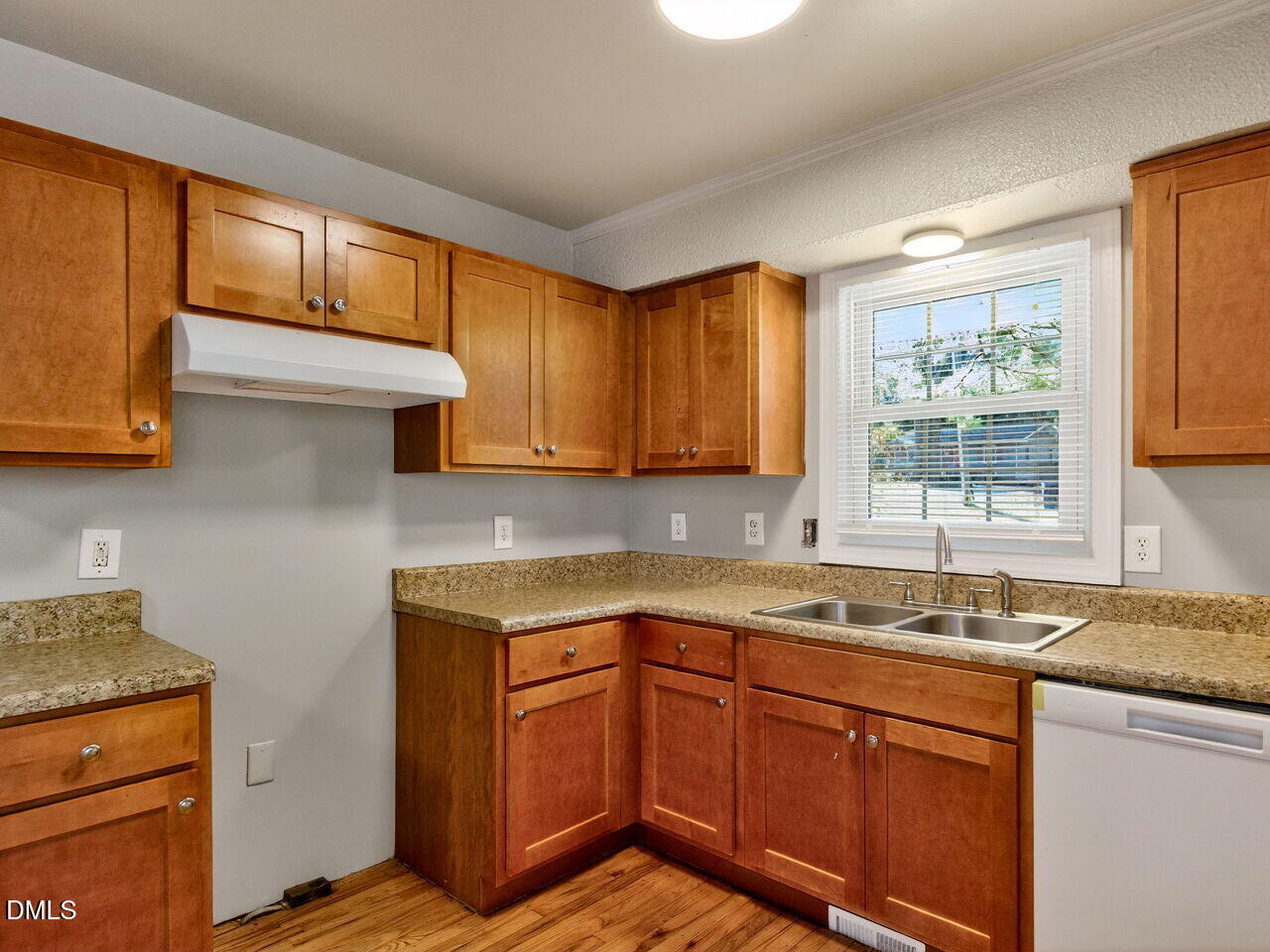 2811 Club Plaza Road Raleigh, NC 27603 - Photo 14 of 38 a kitchen with stainless steel appliances granite countertop wooden cabinets a sink and a stove