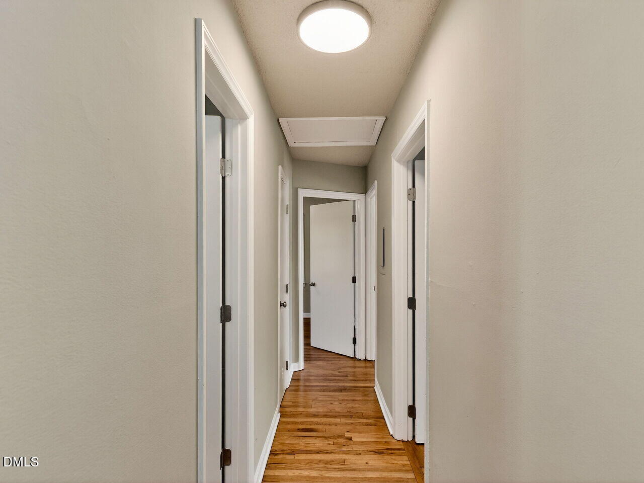2811 Club Plaza Road Raleigh, NC 27603 - Photo 19 of 38 a view of a hallway with wooden floor and staircase