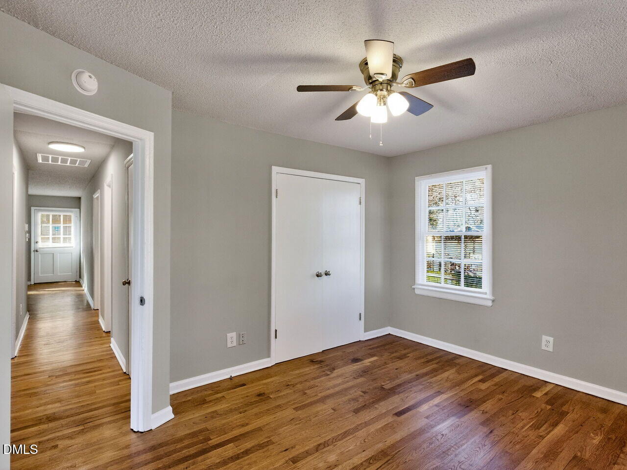 2811 Club Plaza Road Raleigh, NC 27603 - Photo 26 of 38 a view of an empty room with wooden floor and a window
