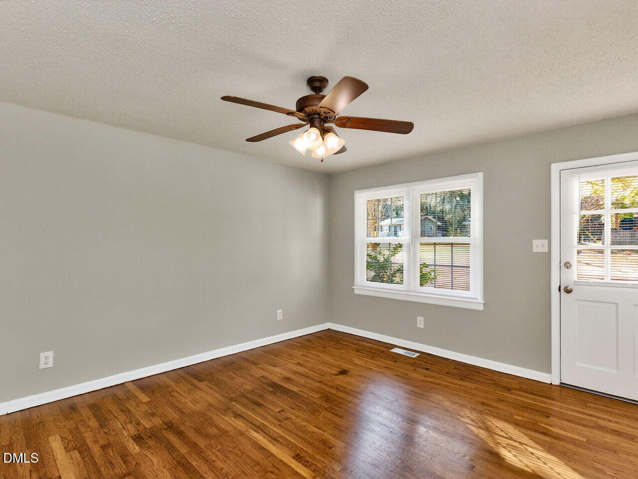 2811 Club Plaza Road Raleigh, NC 27603 - Photo 8 of 38 a view of a room with wooden floor and a ceiling fan