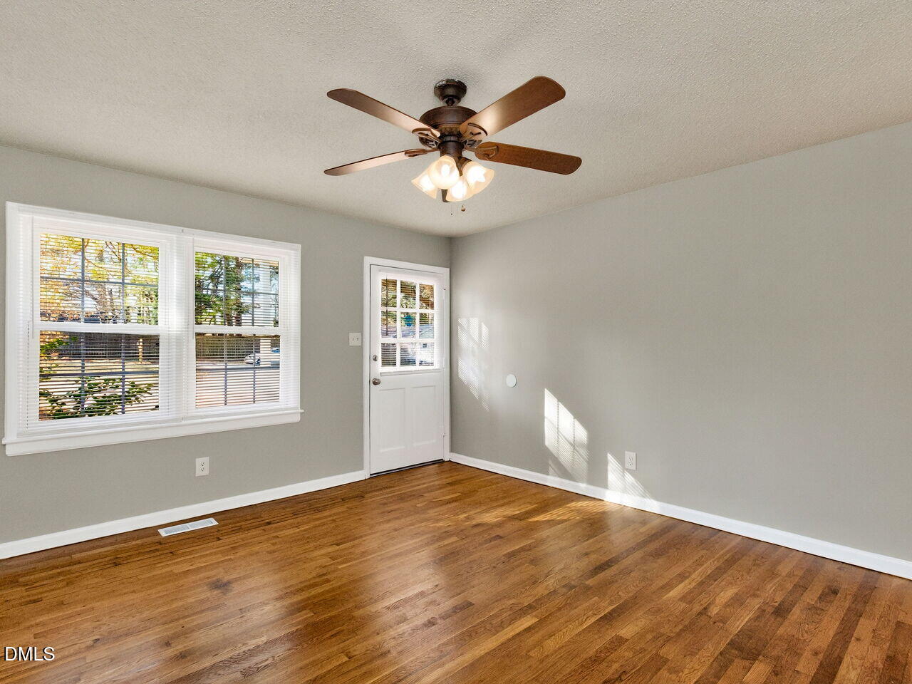 2811 Club Plaza Road Raleigh, NC 27603 - Photo 9 of 38 a view of an empty room with wooden floor and a window