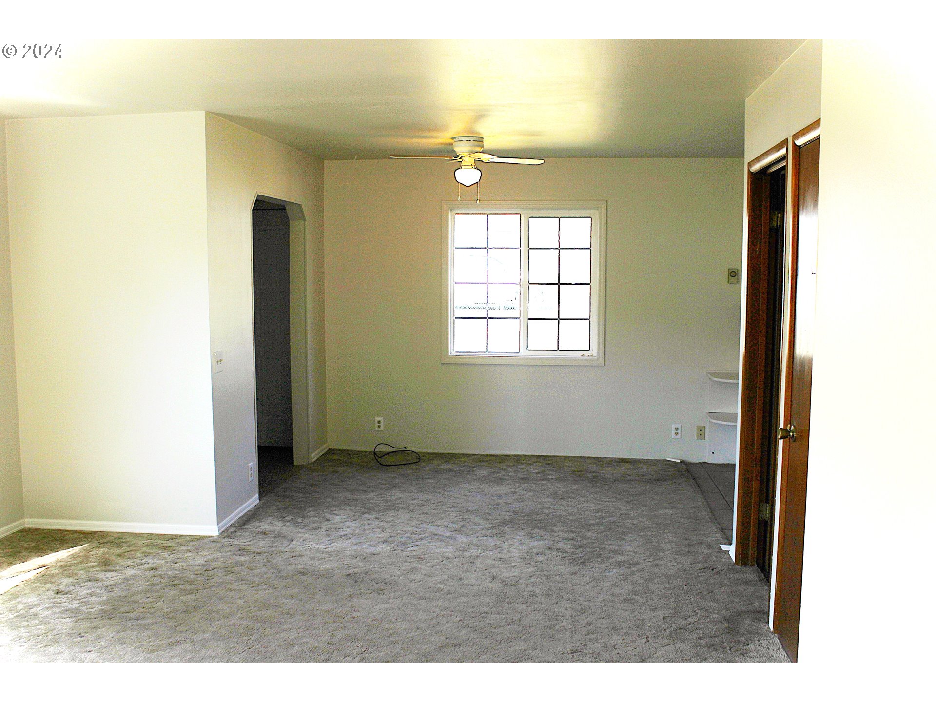 136 Park Street Riddle, OR 97469 - Photo 11 of 17 a view of an empty room with window