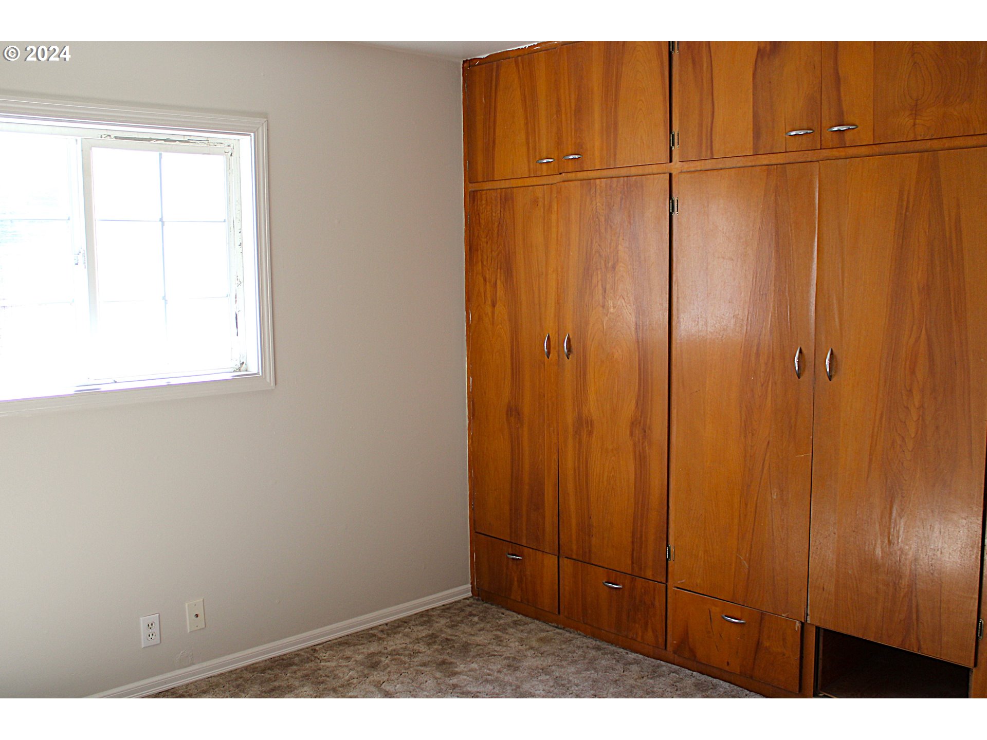 136 Park Street Riddle, OR 97469 - Photo 12 of 17 a view of an empty room with wooden floor