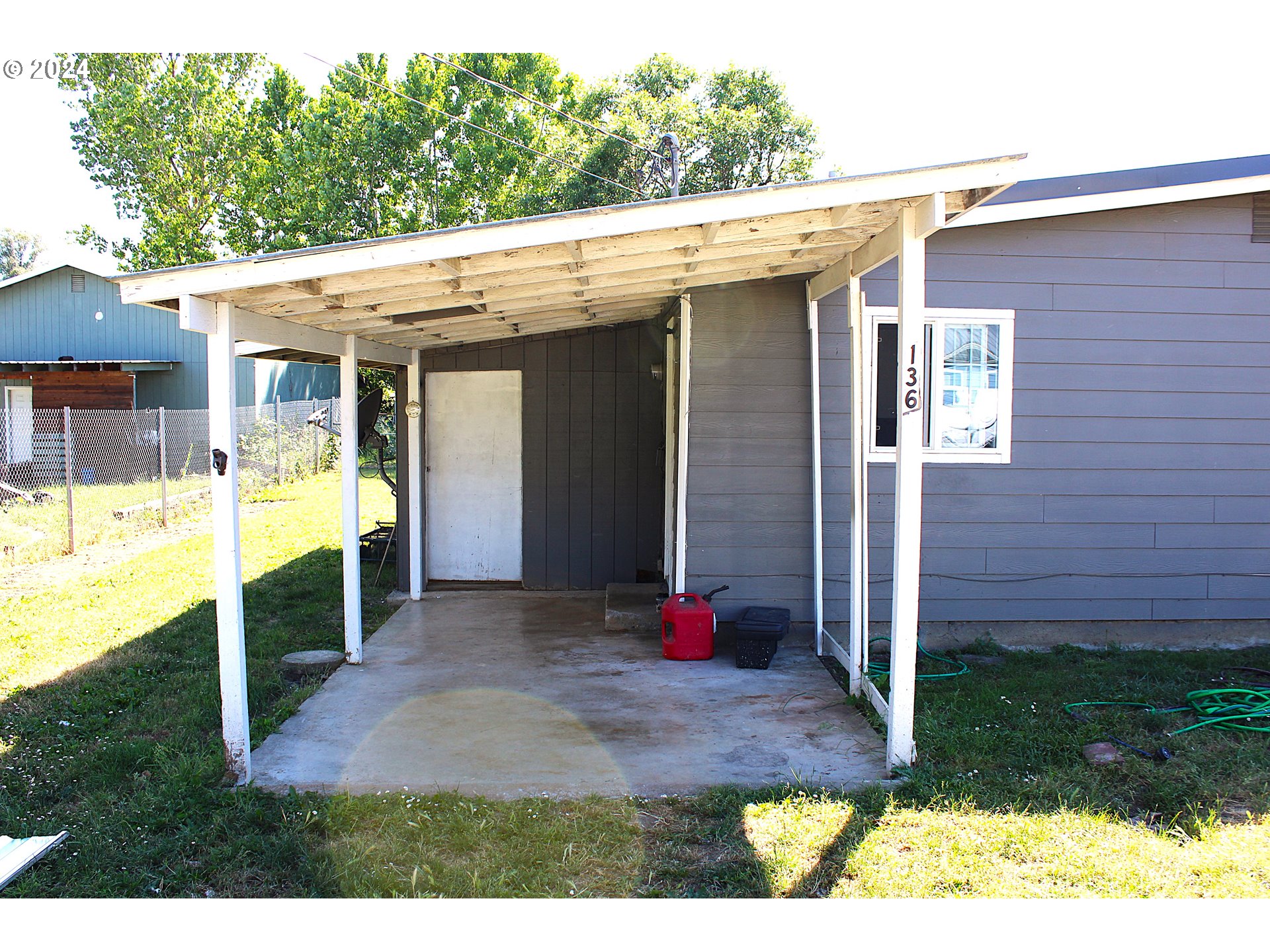 136 Park Street Riddle, OR 97469 - Photo 4 of 17 a view of a house with backyard