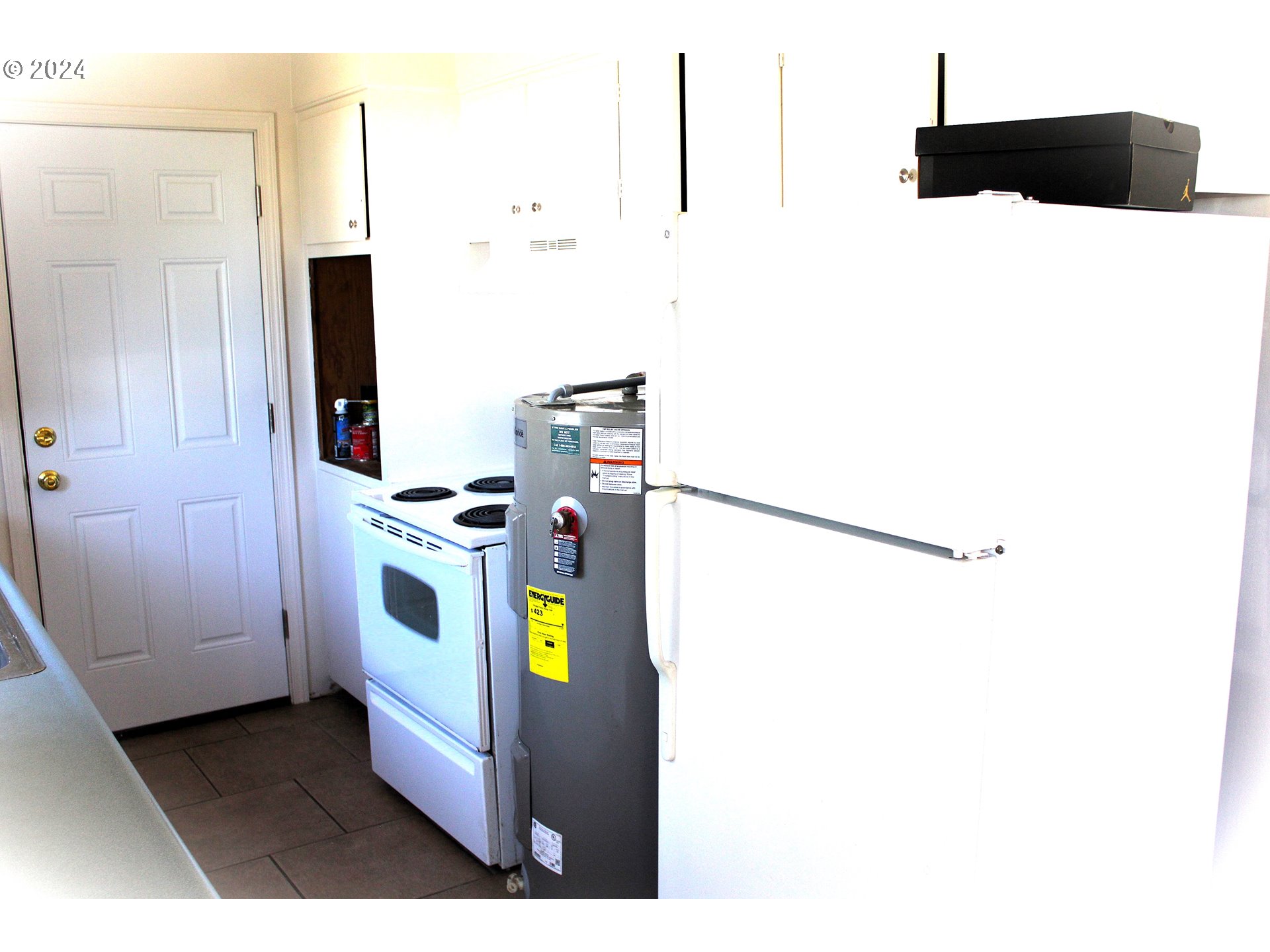 136 Park Street Riddle, OR 97469 - Photo 9 of 17 a kitchen with a refrigerator and a stove