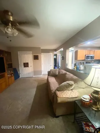 a living room with furniture and a window