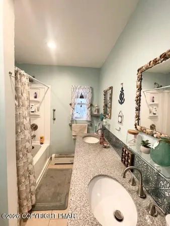 a bedroom with a bed and a mirror