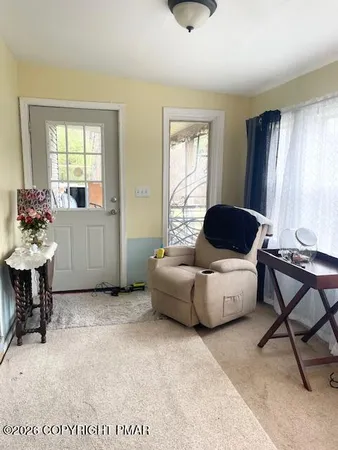 a room with furniture and air hockey table