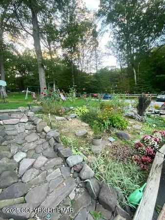 a backyard of a house with lots of green space