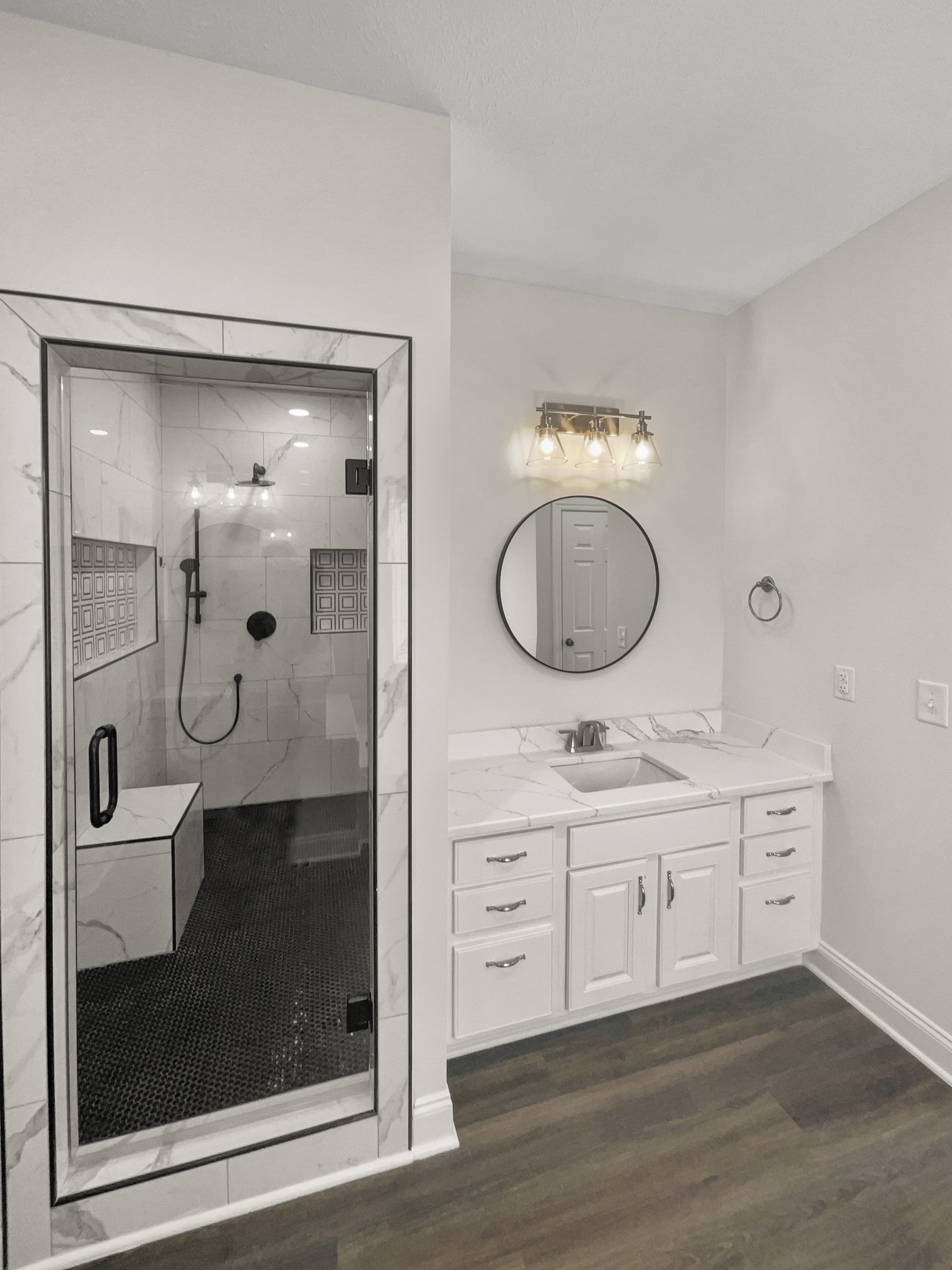 2058 Mossy Oak Circle Clarksville, TN 37043 - Photo 15 of 38 a bathroom with a double vanity sink a mirror and shower