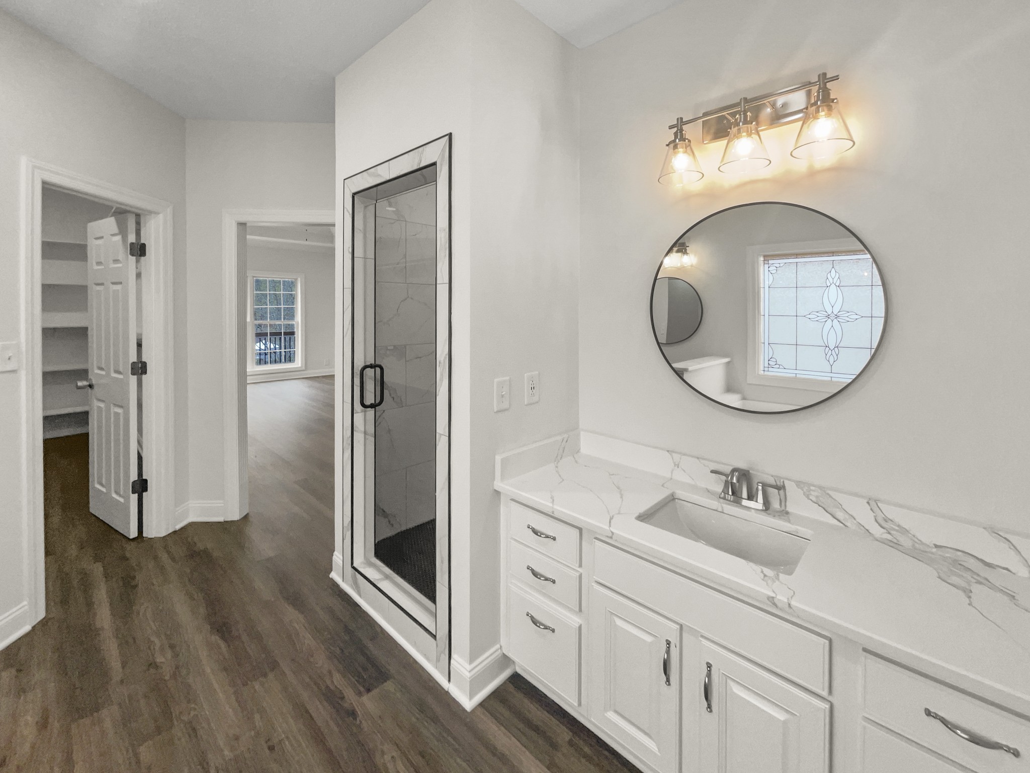 2058 Mossy Oak Circle Clarksville, TN 37043 - Photo 16 of 38 a bathroom with a double vanity sink mirror and shower
