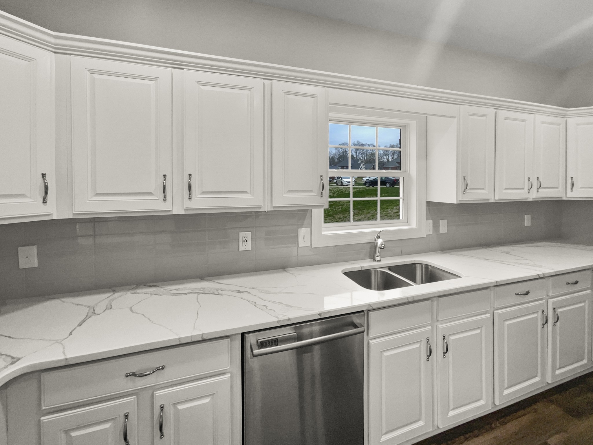 2058 Mossy Oak Circle Clarksville, TN 37043 - Photo 19 of 38 a kitchen with white cabinets and a sink